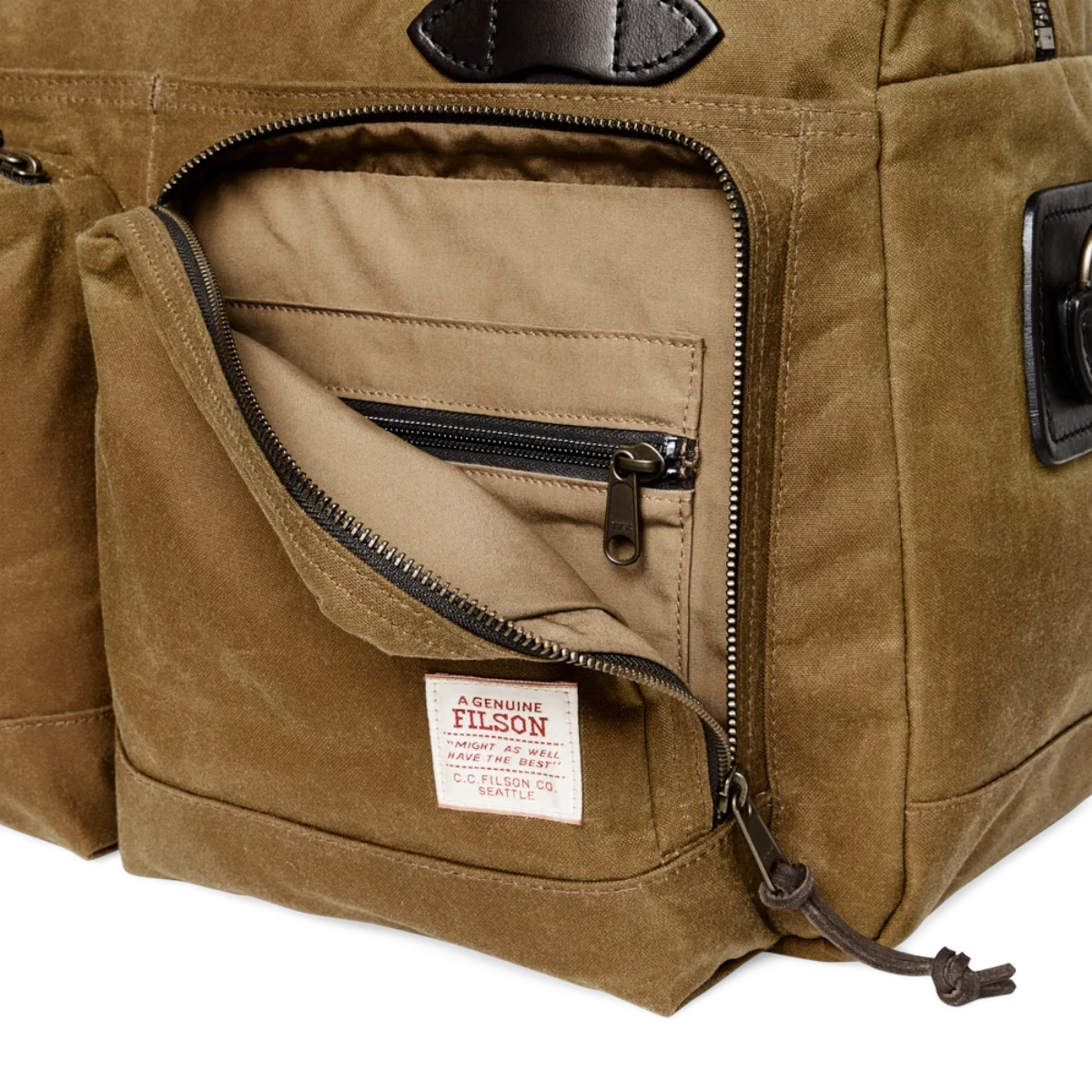 MILWORKS Filson 48 Hour Tin Cloth Duffle in dark tan featuring an open front pocket with a branded woven label