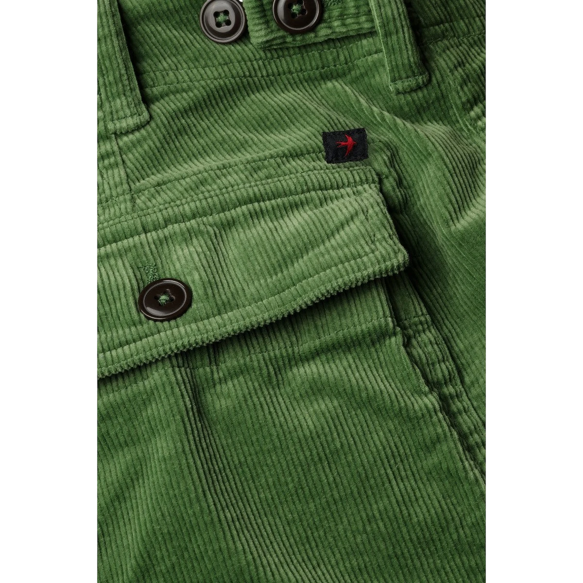 MILWORKs green corduroy shorts with 7.5" inseam, button flap pocket, and branded tag.