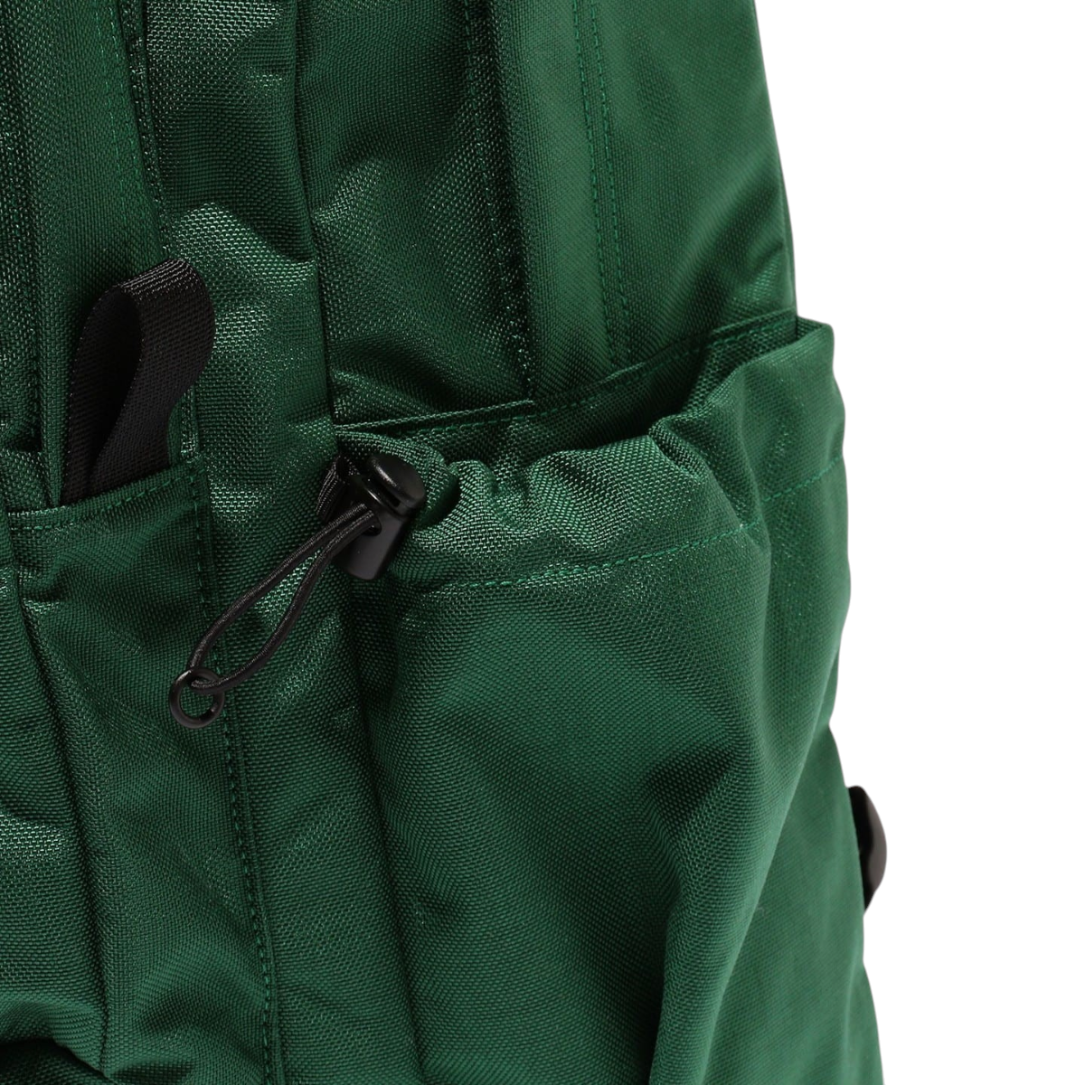 MILWORKS green day pack featuring a durable fabric exterior with a convenient side drawstring pocket for bottles.
