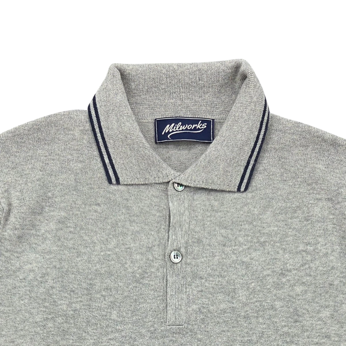 MILWORKS grey knit cashmere blend short sleeve polo shirt with navy trim on collar and button placket.