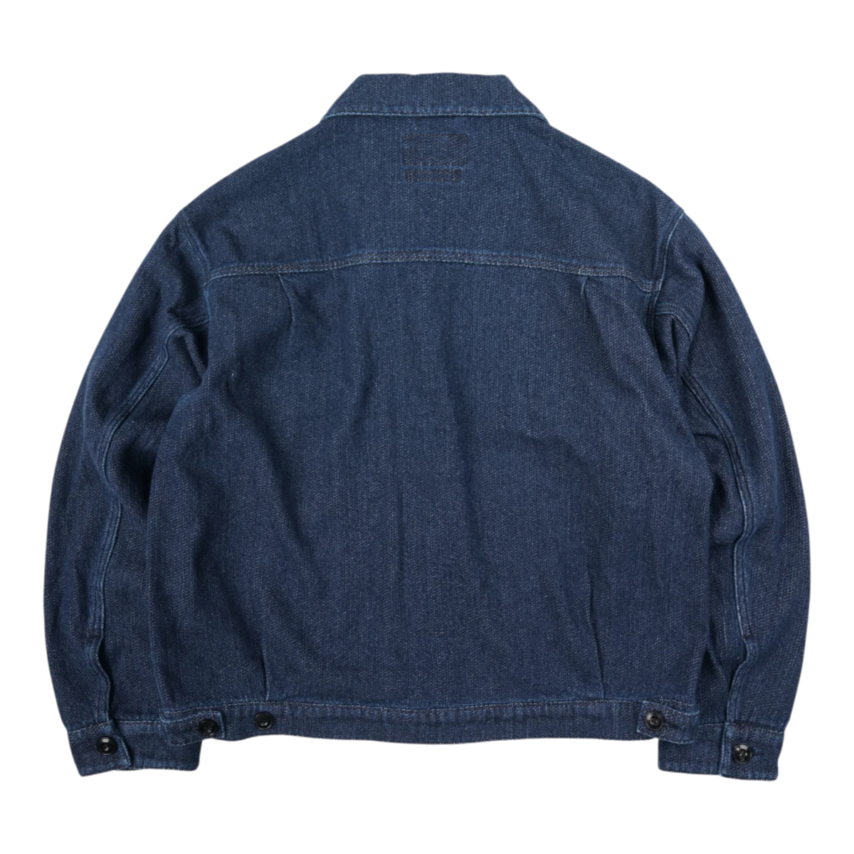 MILWORKS indigo sashiko trucker jacket, back view showing textured fabric, reinforced seams, and buttoned cuffs.