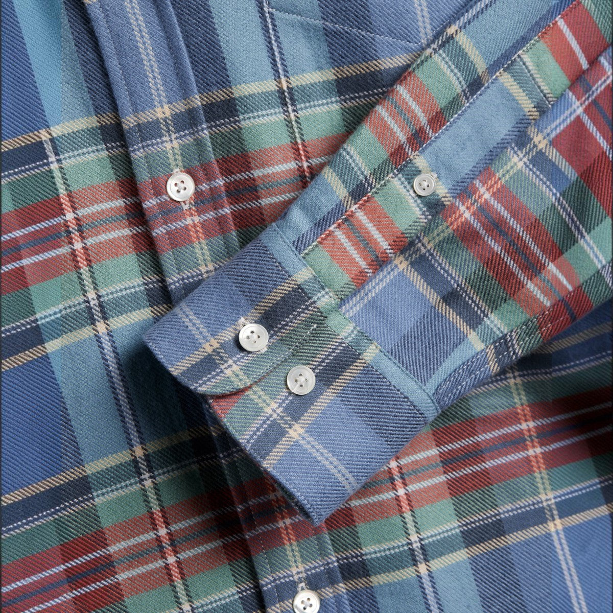 MILWORKS Lucia plaid flannel shirt in blue, green, and red cotton with mother of pearl buttons on the cuff