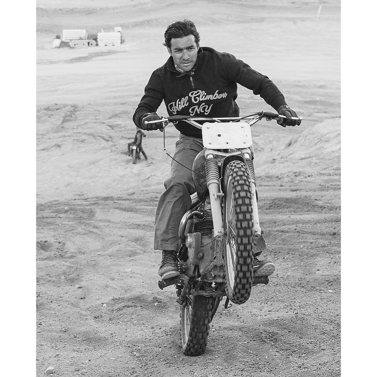 MILWORKS maroon wool quarter-zip sweater with Hill Climbers NY embroidery worn by a man riding a vintage motorcycle