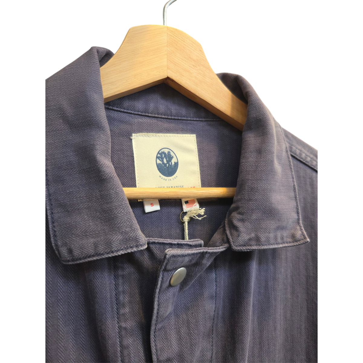 MILWORKS mechanic coverall in deep blue Japanese herringbone twill with a vintage collar and concealed snap closure.