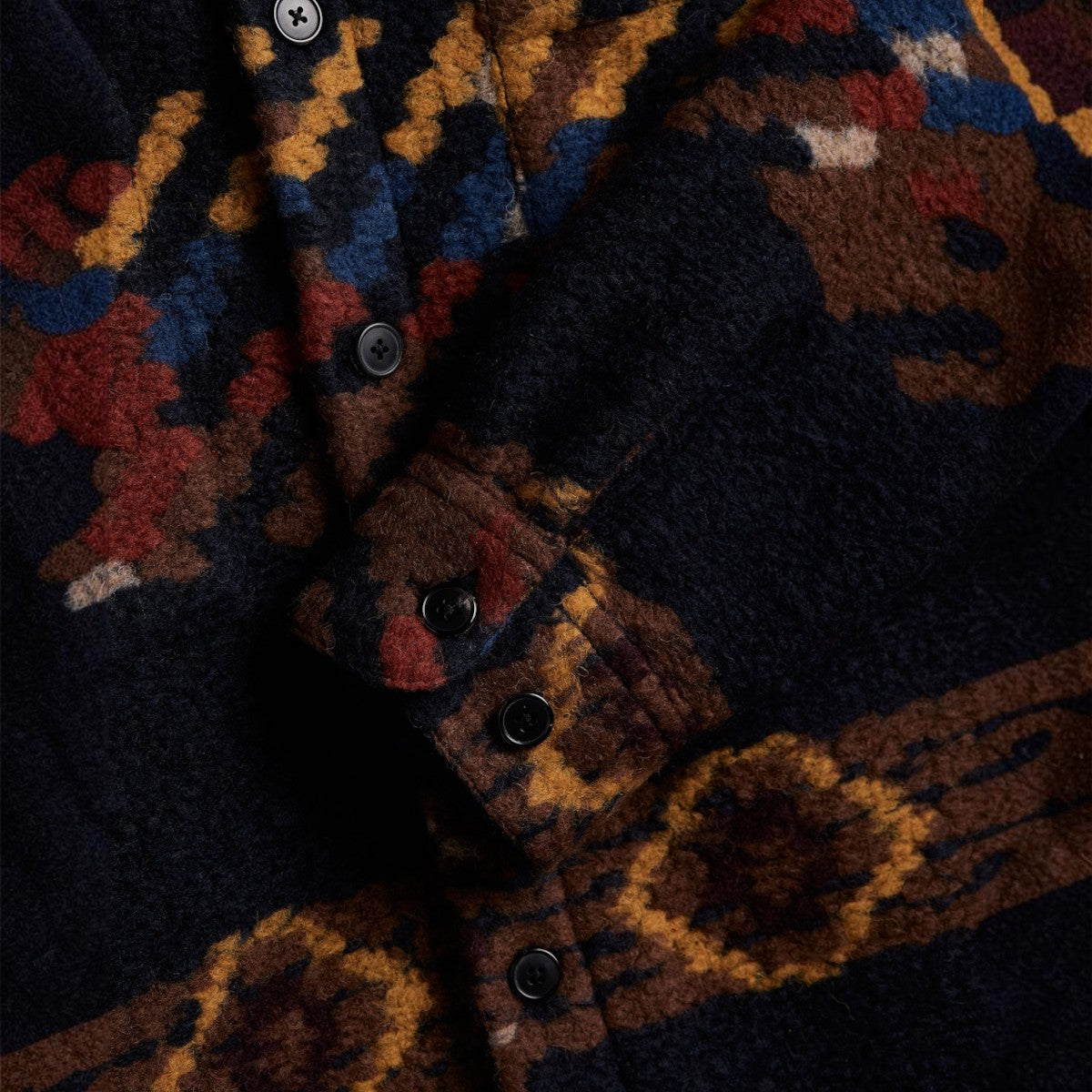 MILWORKS Mia wool blend overshirt featuring a dark patterned fabric with mother of pearl buttons and cuff detail