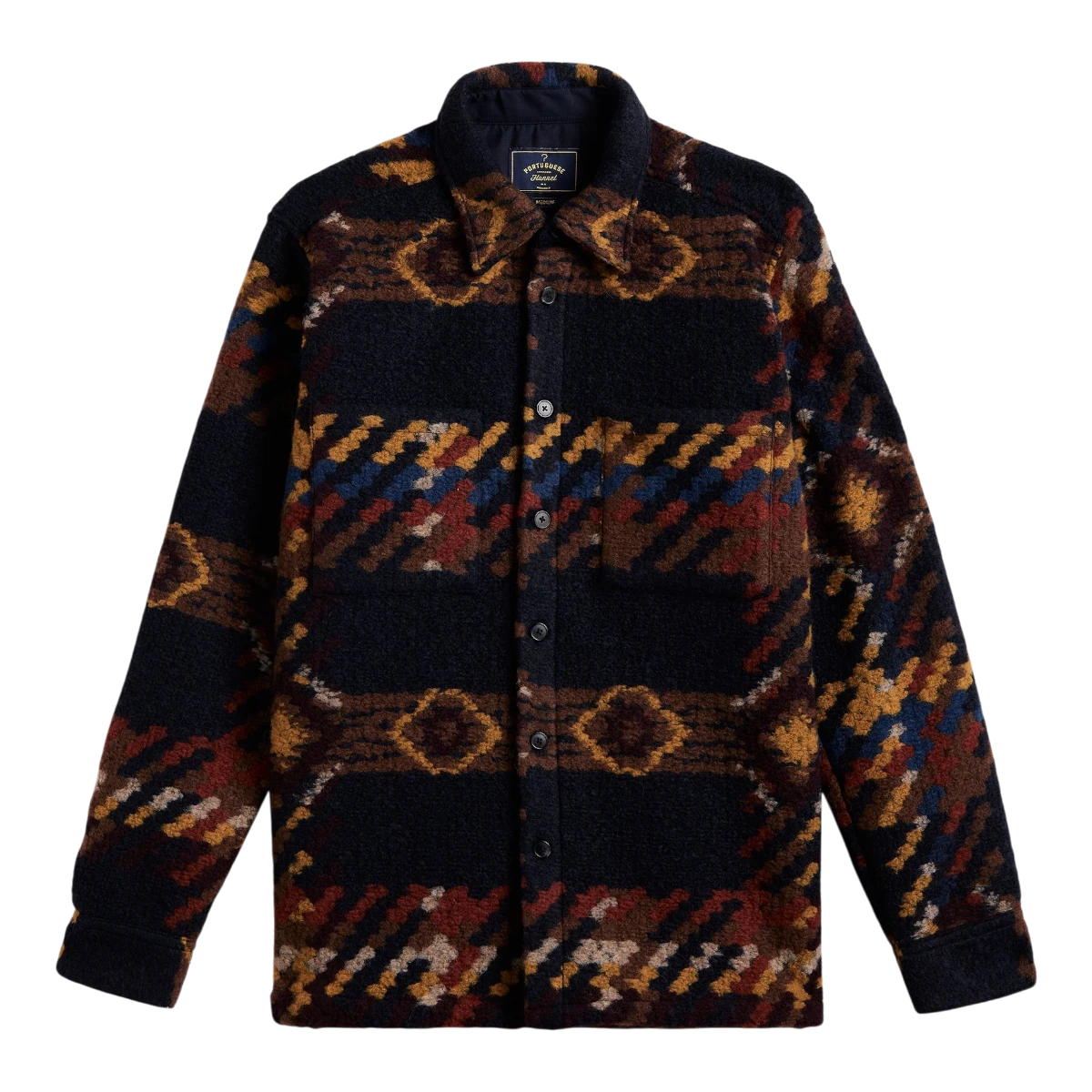 MILWORKS Mia wool blend overshirt featuring a dark multi-colored geometric pattern and mother of pearl buttons.