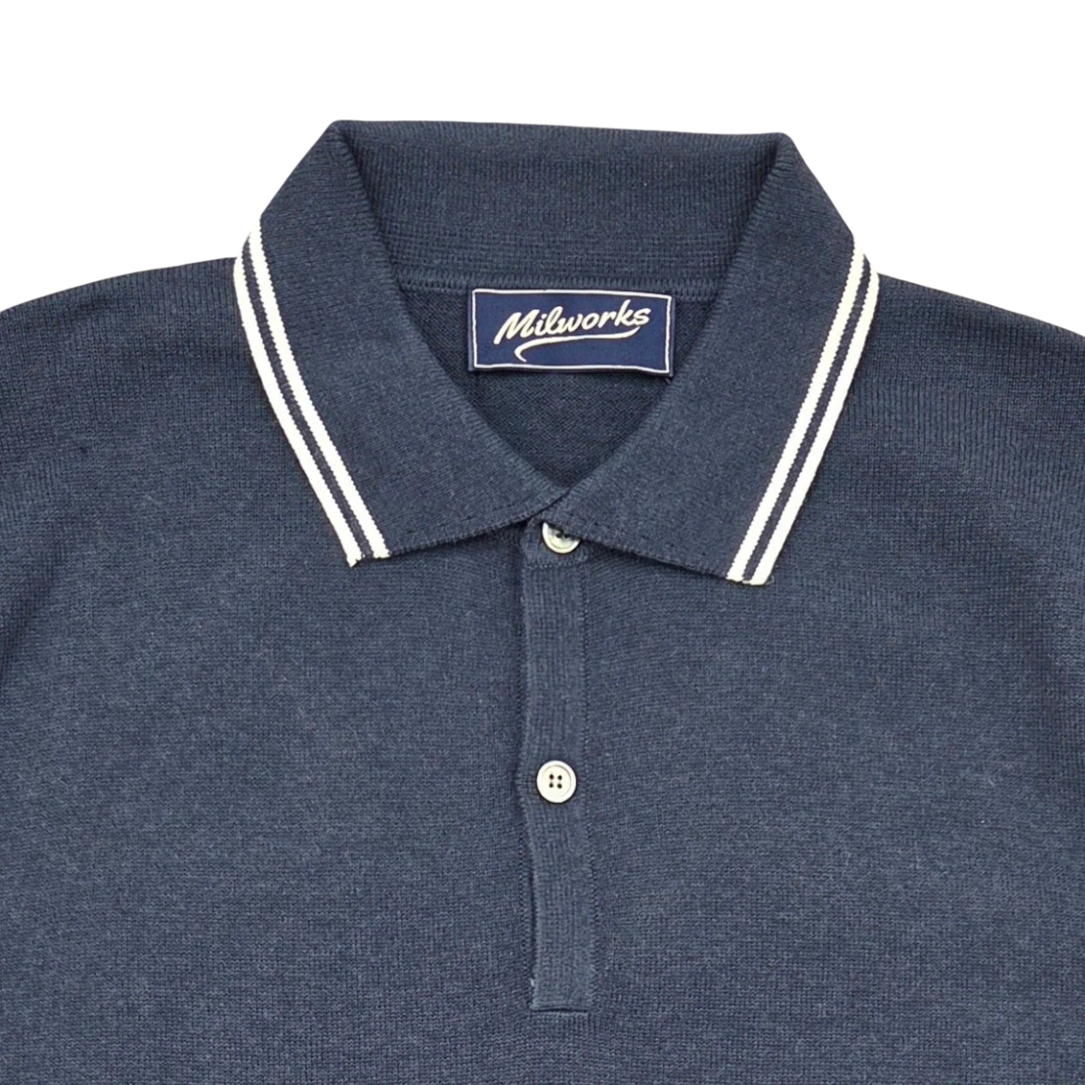 MILWORKS navy blue short sleeve knit polo shirt with white striped collar. Made from 95% cotton and 5% cashmere.