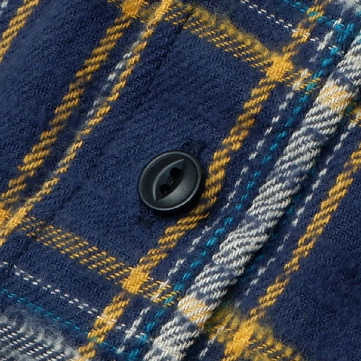 MILWORKS navy slub heavy flannel shirt with a textured brushed finish and a small yellow and grey check pattern