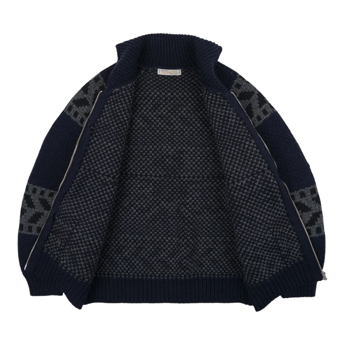 MILWORKS navy wool blend Cowichan cardigan jacket with thunderbird motif and two-way zipper, shown open.