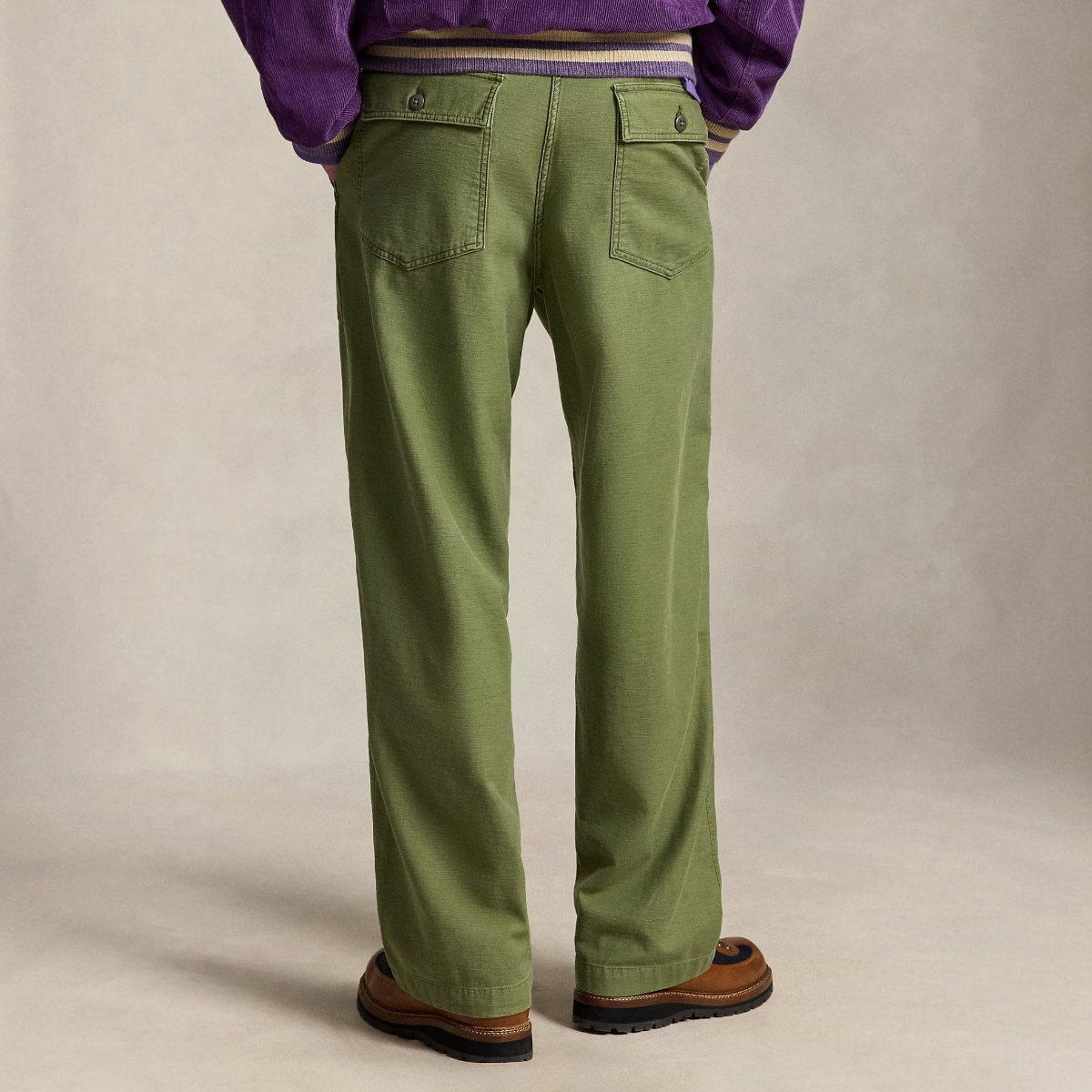 MILWORKS olive green relaxed fit utility pants in reverse-sateen cotton with back buttoned pockets, rear view.