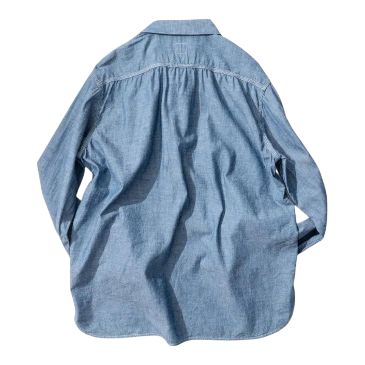 Back view of a MILWORKS Ordinary Fits indigo chambray work shirt in 100% cotton with a relaxed boxy fit.