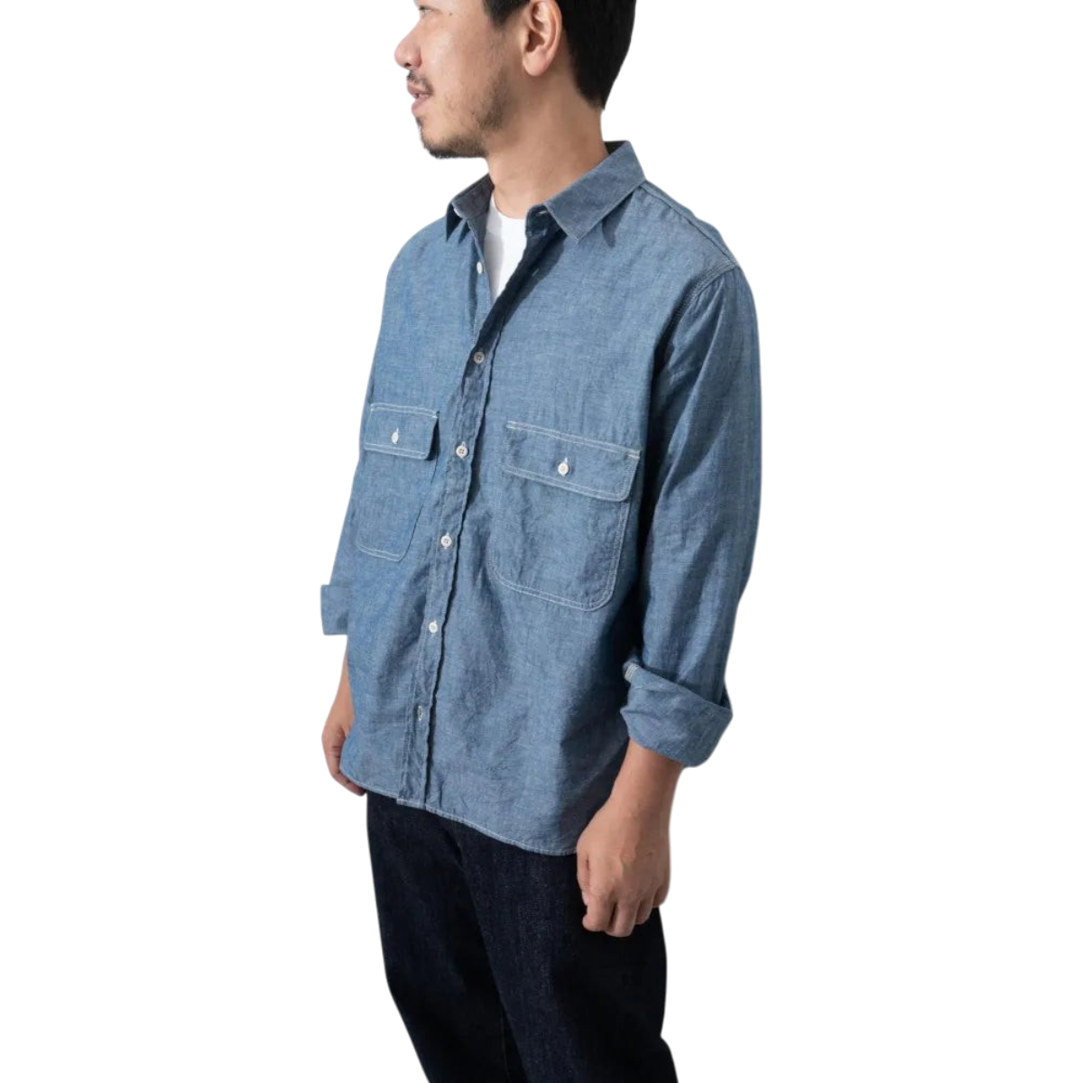 MILWORKS Ordinary Fits indigo chambray work shirt with boxy fit, oversized pockets, and long sleeves on a model.
