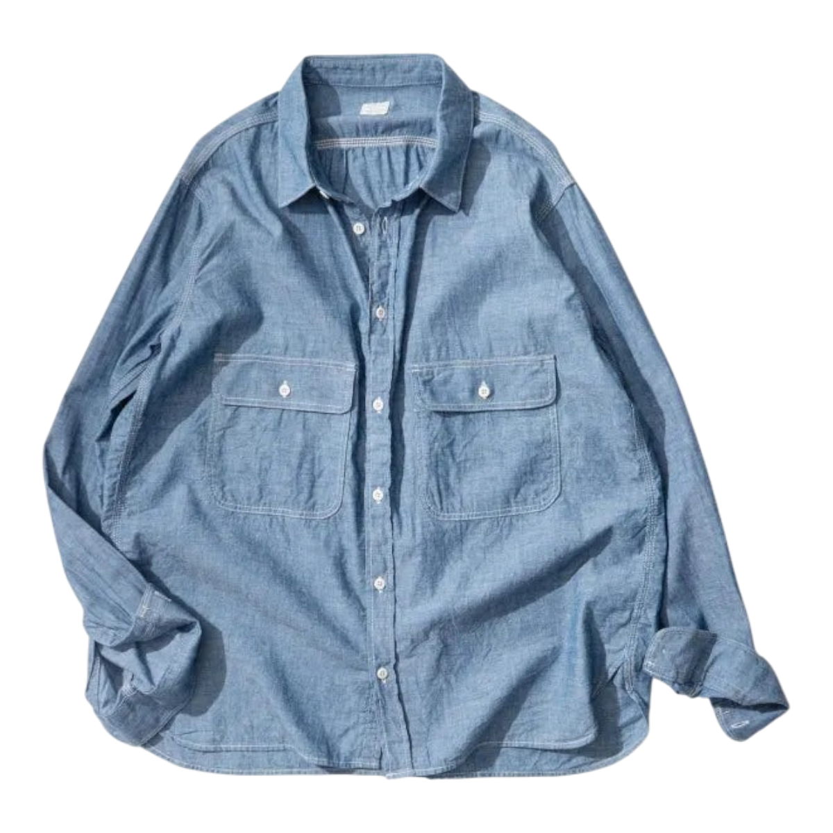 MILWORKS Ordinary Fits indigo chambray work shirt with a boxy fit, oversized chest pockets, and button-down front.