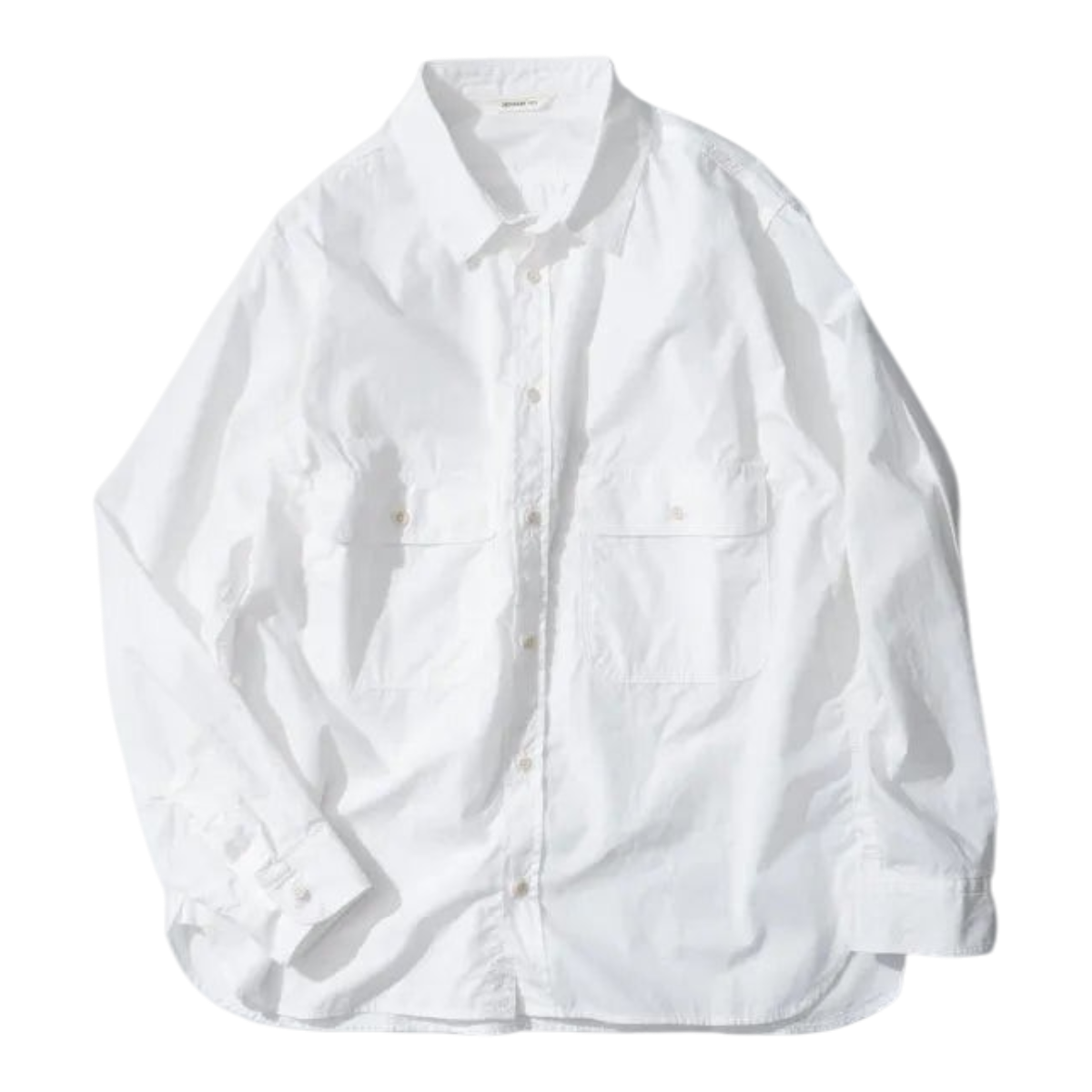 MILWORKS Ordinary Fits white cotton work shirt with a boxy silhouette and oversized chest pockets.