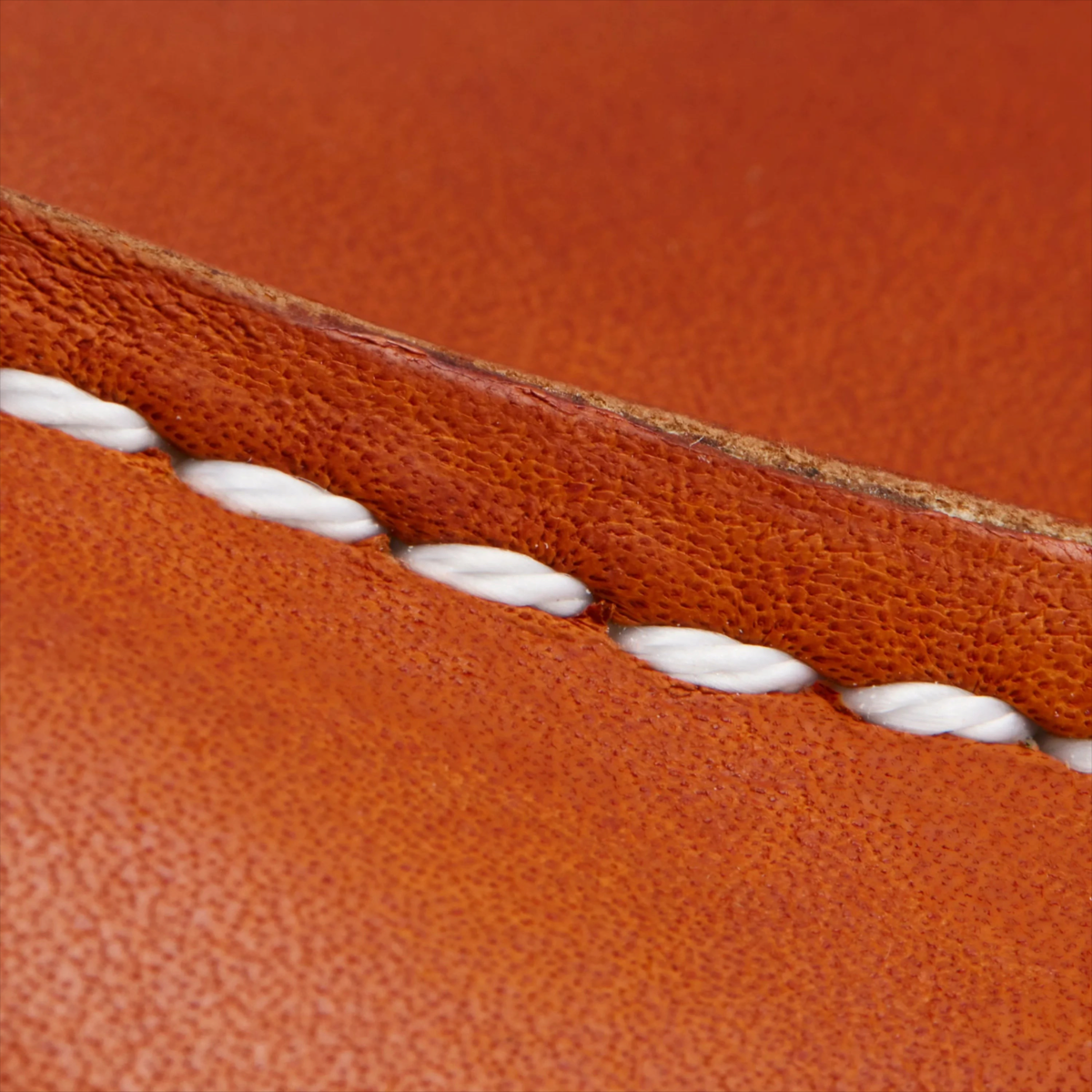 Close-up of MILWORKS Shop Moc Oxford in Oro Legacy leather showing white Puritan triple-stitching detail