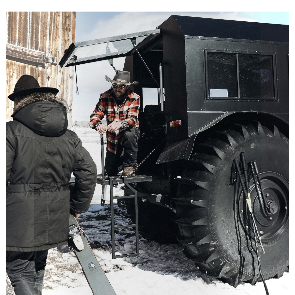 MILWORKS quilted plaid wool overshirt in red and black worn by a man standing on a large off-road vehicle in snow