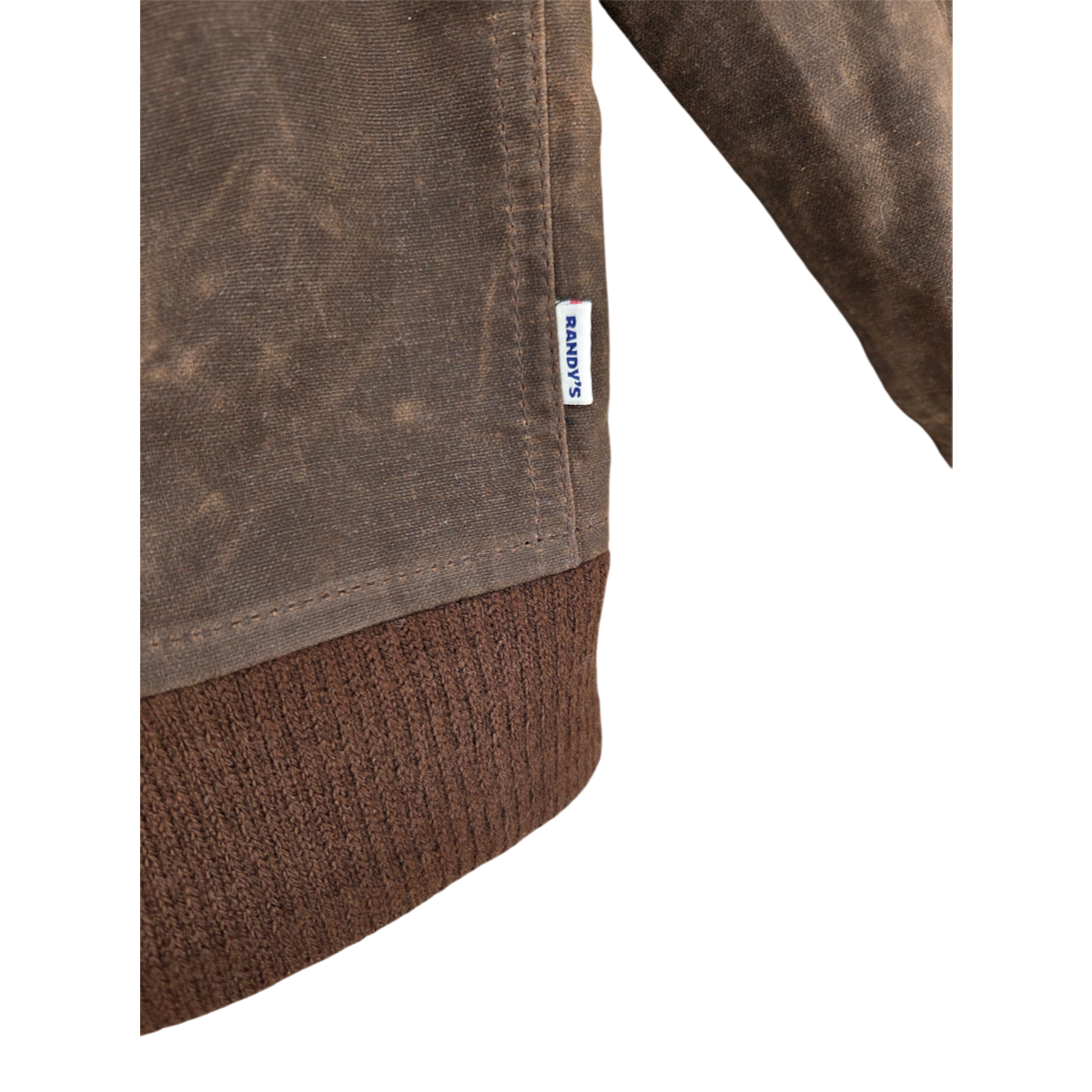 MILWORKS Randy Garments Maine jacket in dark brown waxed sailcloth cotton with a ribbed hem and branded side tab