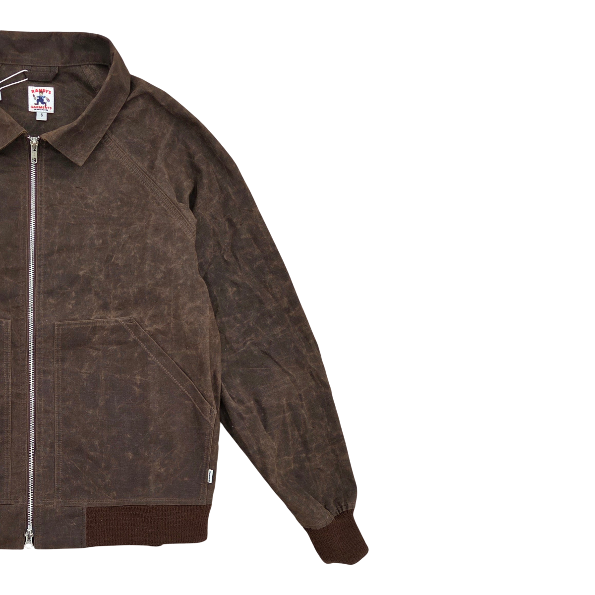 MILWORKS Randy Garments dark brown waxed sailcloth Maine jacket with a front zip closure and ribbed cuffs