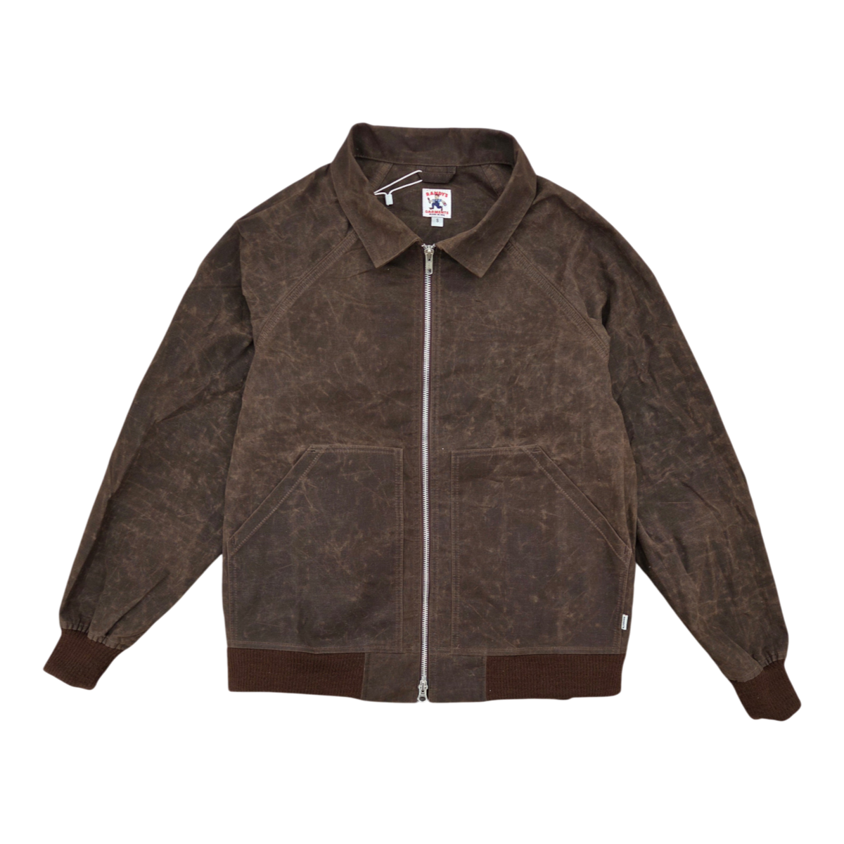 MILWORKS Randy Garments Maine jacket in dark brown waxed sailcloth cotton with a front zip and ribbed cuffs.