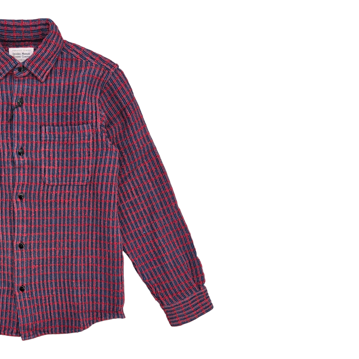 MILWORKS No111 overshirt in a red and blue handwoven cotton check pattern with a chest pocket and rounded hem.