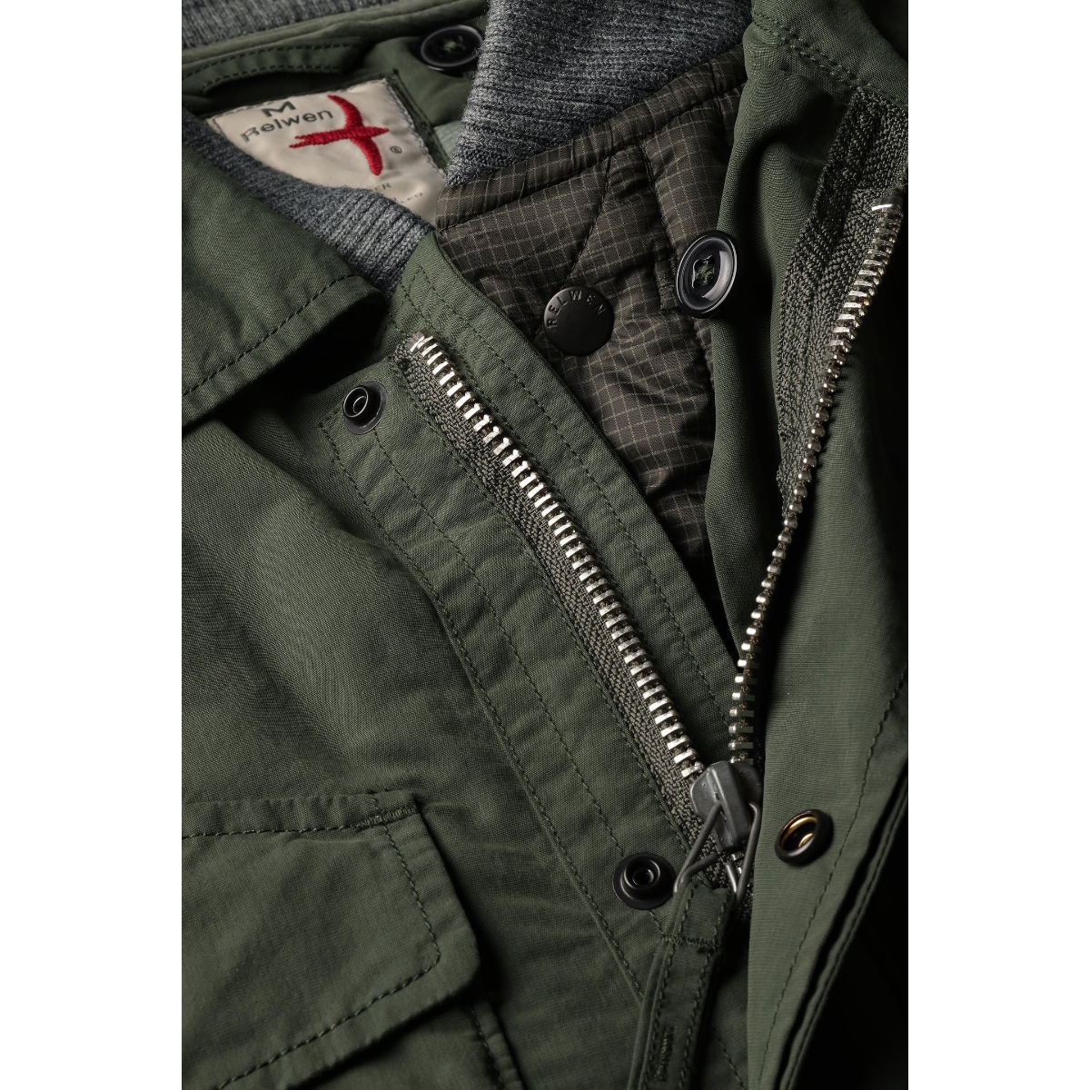 Relwen dark forest green 2-in-1 military jacket with quilted liner, metal zipper, and snap button closure details.