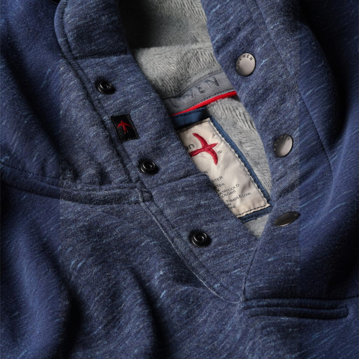 MILWORKS Relwen navy micropile hoodie featuring a snap button placket and soft grey fleece lining