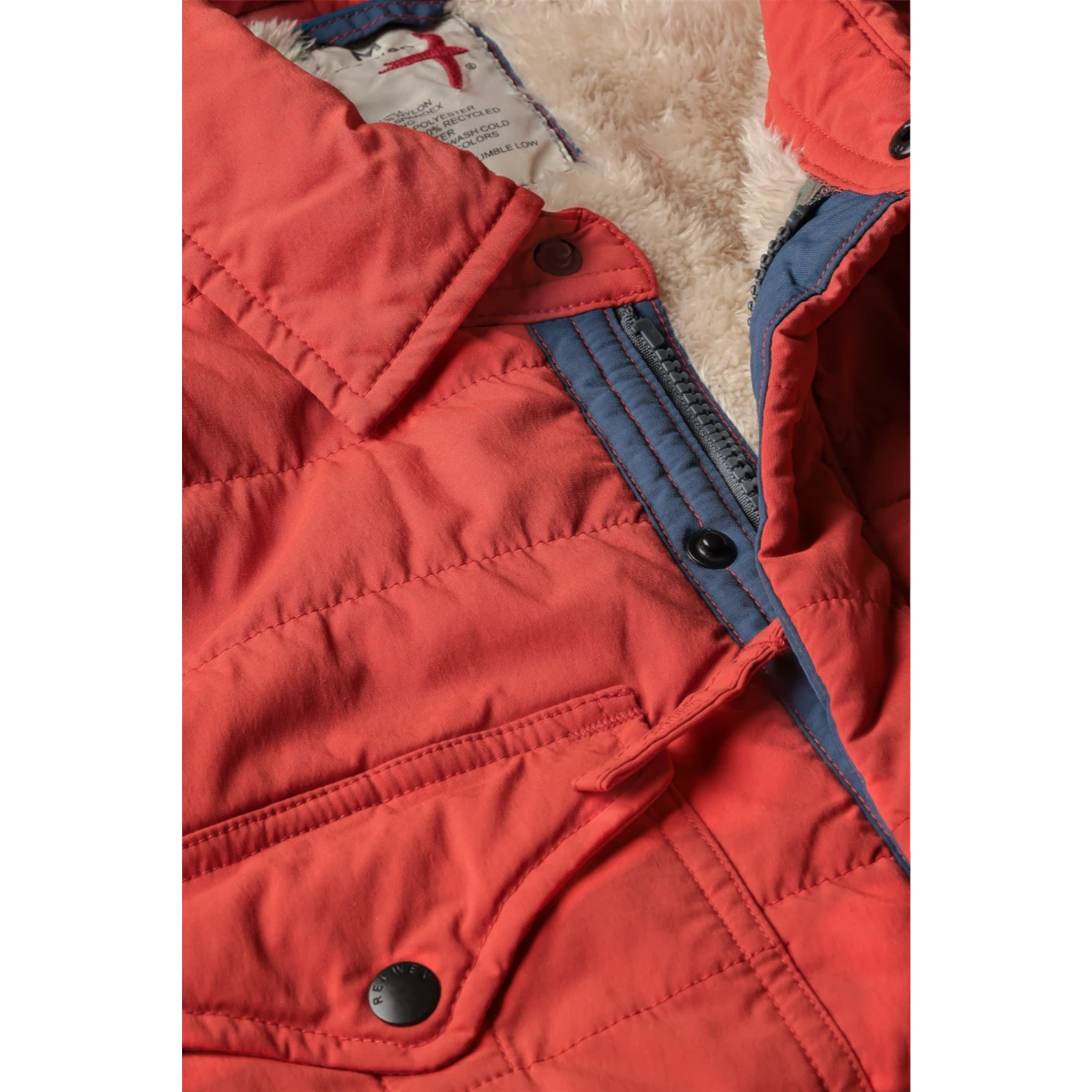 MILWORKS Relwen quilted dark orange jacket with a soft fleece lining and snap button closure
