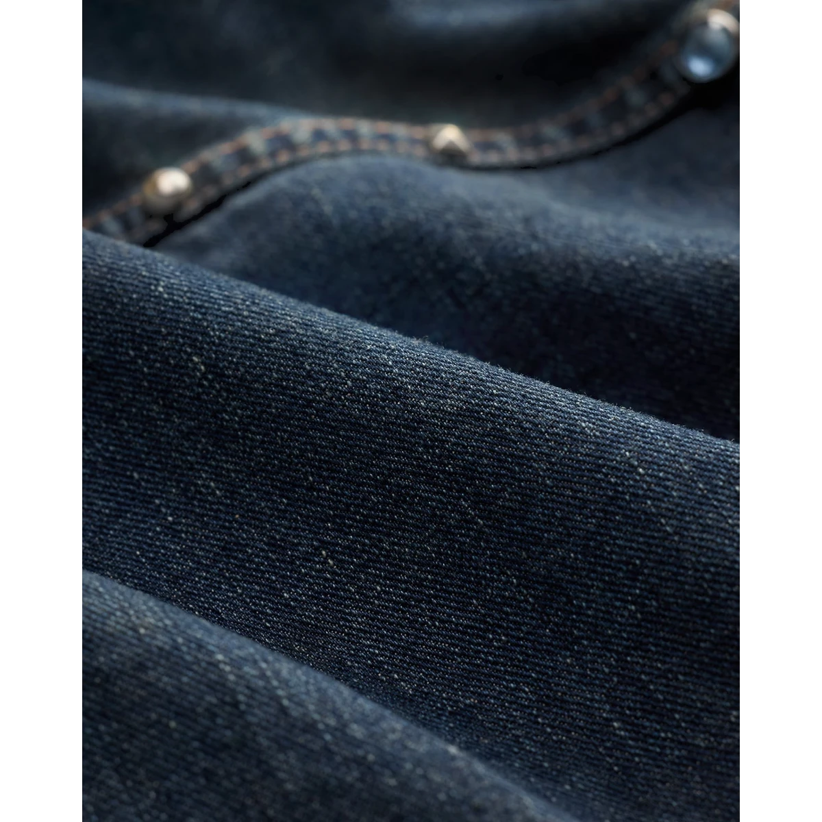 MILWORKS Ridgewood studded denim trucker jacket in indigo Japanese denim with metallic stud detailing