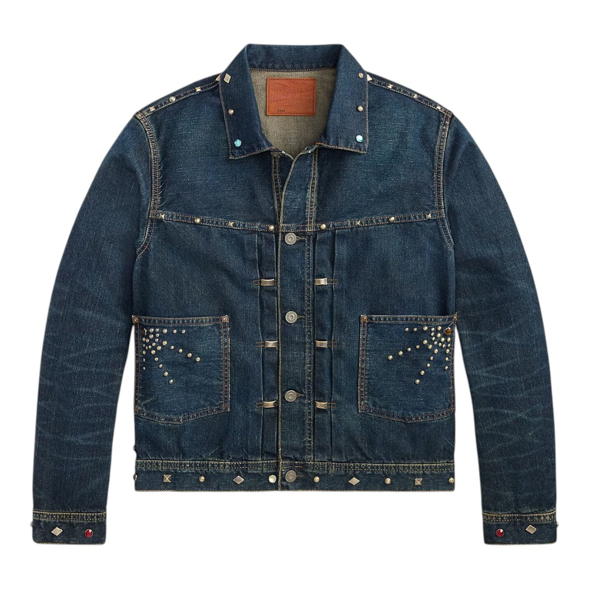 MILWORKS Ridgewood studded indigo denim trucker jacket with vintage wash, front patch pockets, and buckled back.