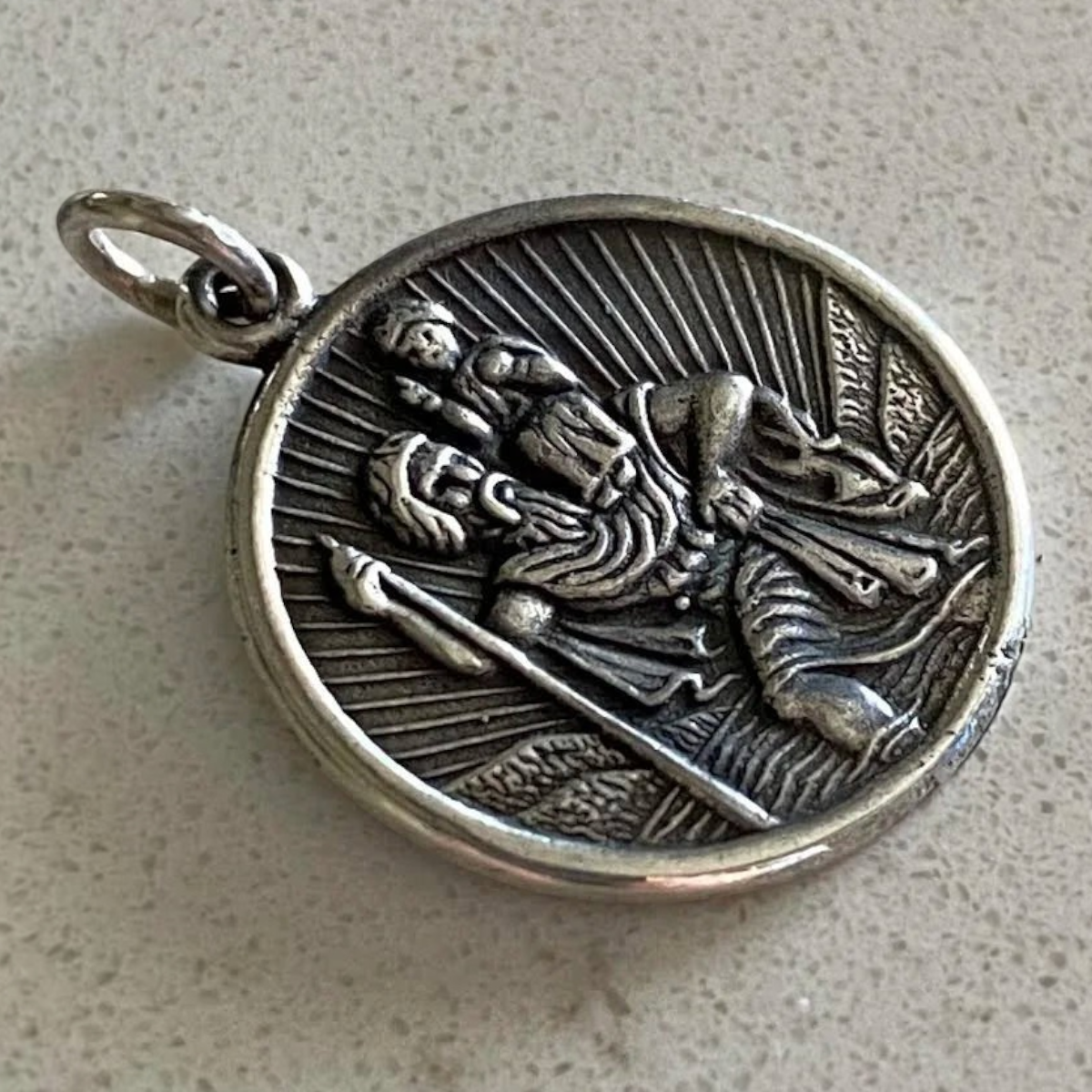 MILWORKS Roadtrip Charm featuring a small sterling silver Saint Christopher medallion for travelers