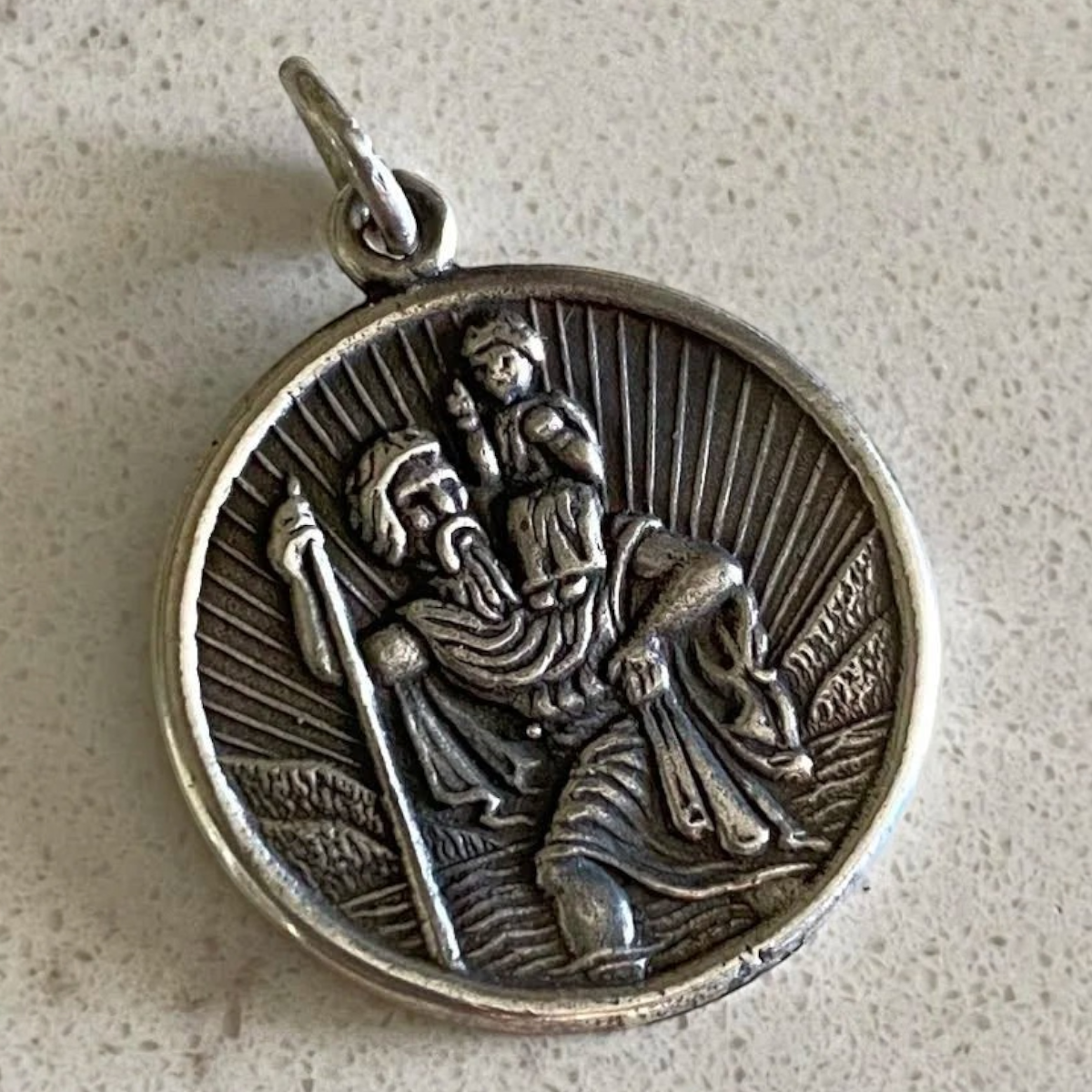 MILWORKS Roadtrip Charm featuring a small round Saint Christopher sterling silver pendant for travelers.