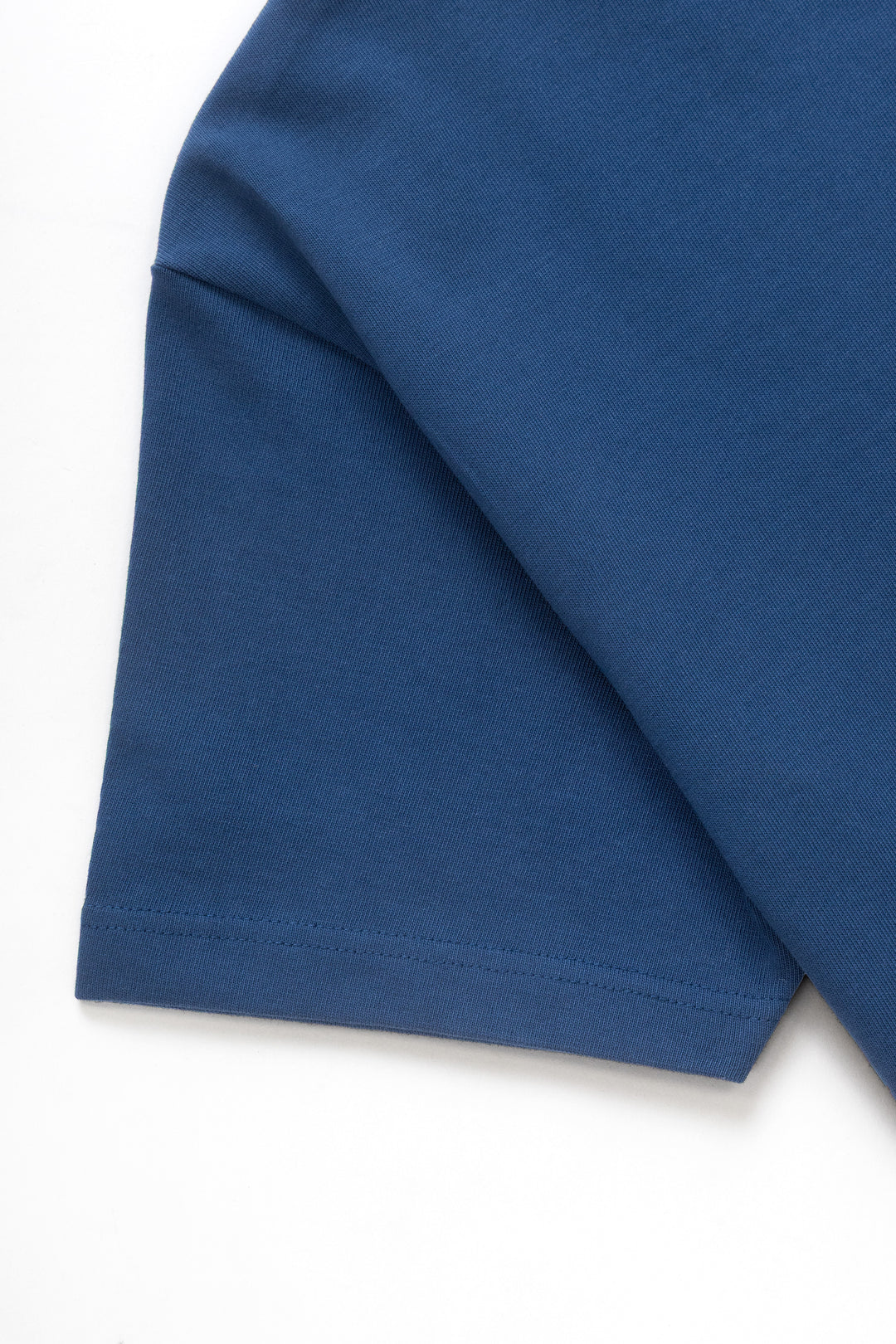 MILWORKS royal blue heavyweight organic cotton t-shirt sleeve detail showing dense jersey fabric texture