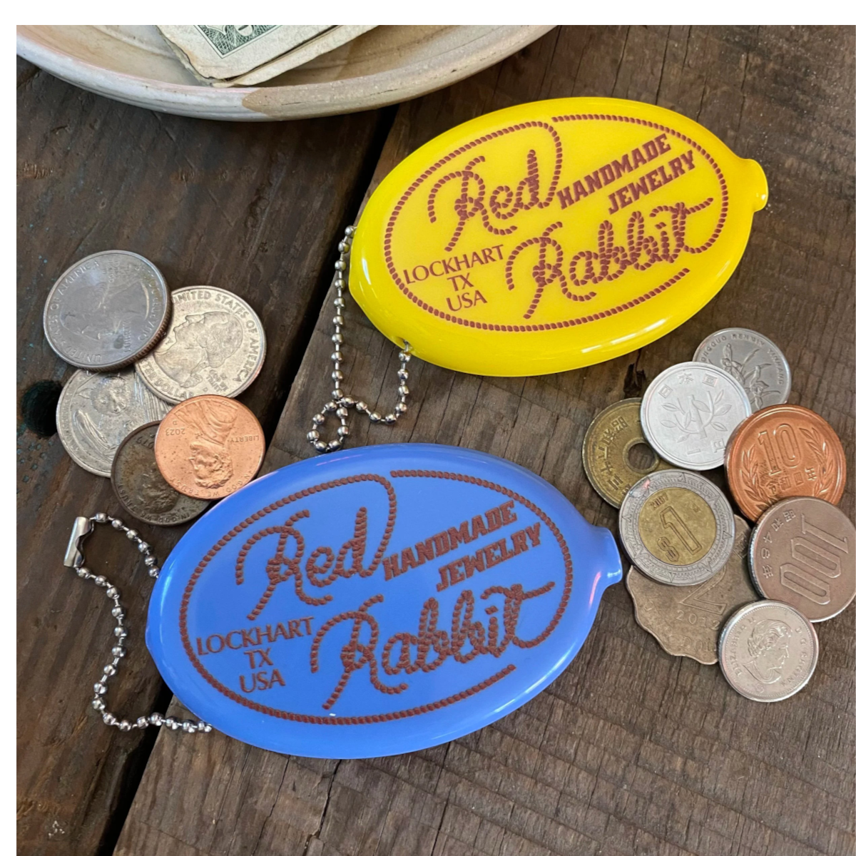 MILWORKS RR Coin Keeper squeeze pouches in steel blue and bright yellow with Red Rabbit logo and metal key chains