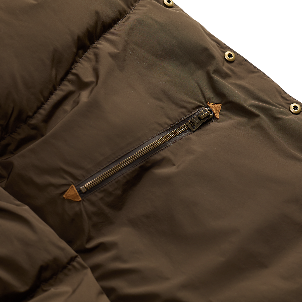 MILWORKS RRL black nylon coat featuring a zippered chest pocket with cowhide leather trim and brass hardware