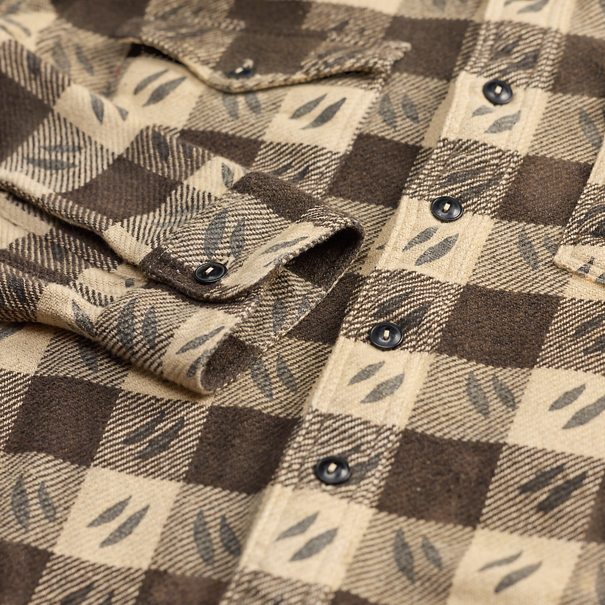 MILWORKS RRL wool long sleeve sports shirt in a brown and cream checkered pattern with leaf motifs and button cuffs.