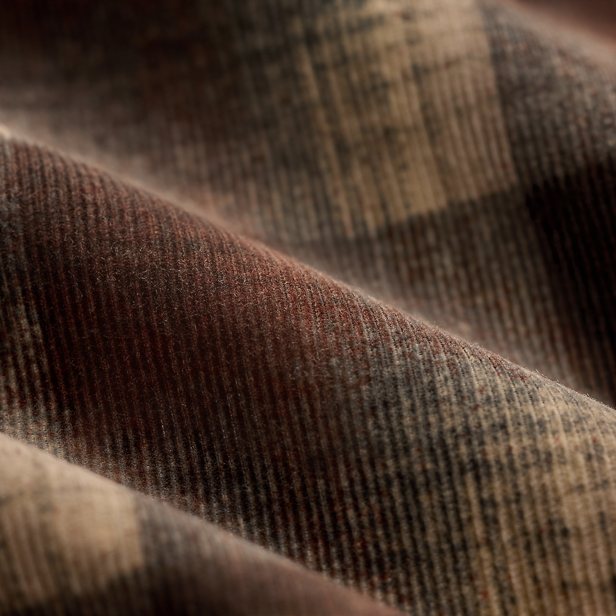 Close-up of MILWORKS RRL brown and grey plaid corduroy fabric with fine ribbed texture.