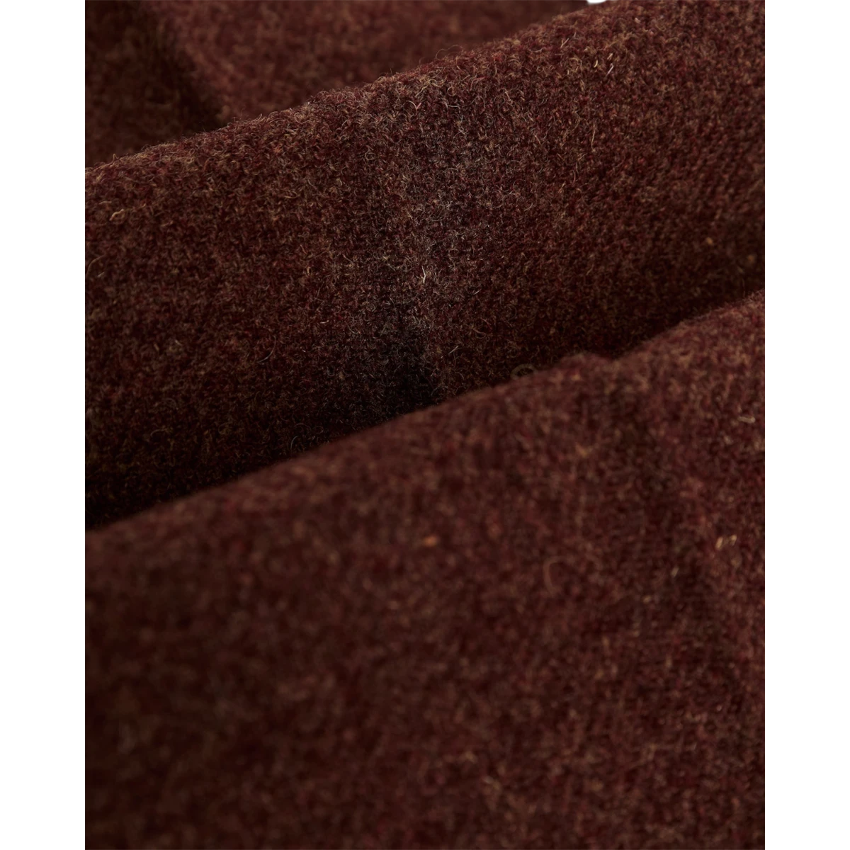 Close-up of MILWORKS Portuguese Flannel Single Pleat Trousers in deep burgundy virgin wool fabric