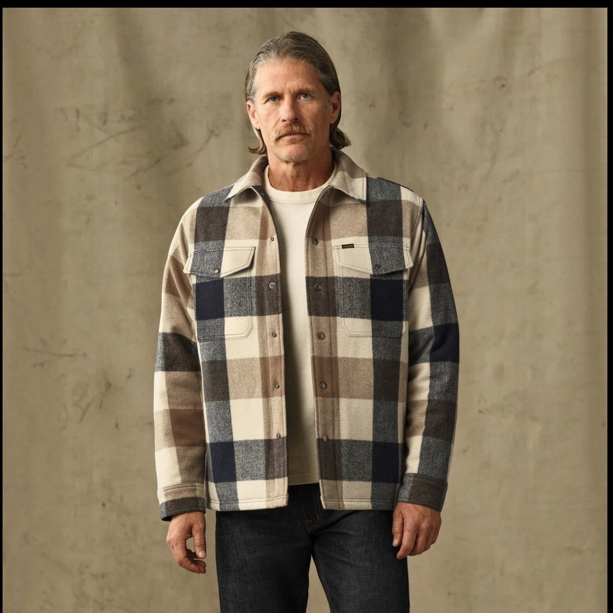 MILWORKS Spokane insulated jac-shirt in cream and navy plaid wool-blend with snap-front closure on a male model