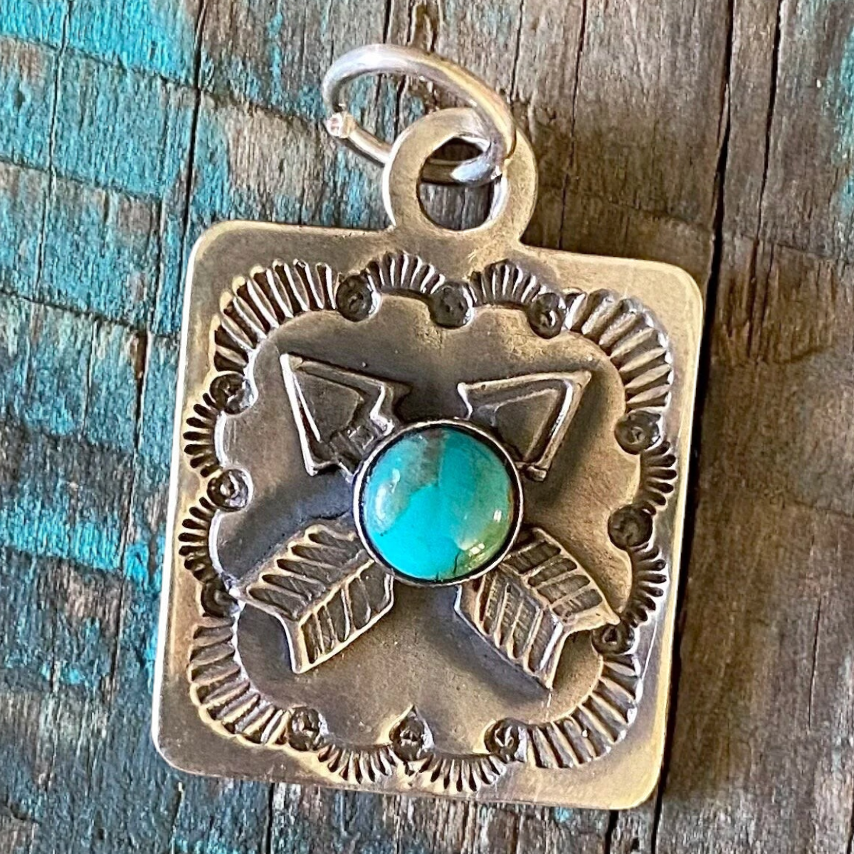 MILWORKS sterling silver dog tag pendant featuring a turquoise stone and arrow design in a Southwest style