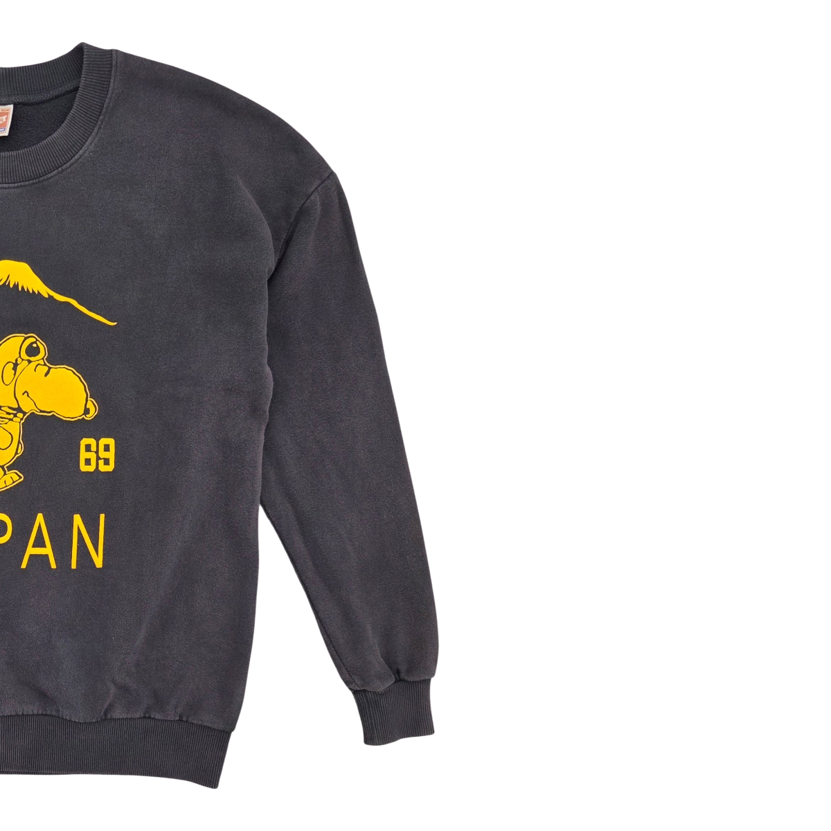 MILWORKS Suka Snoopy sweatshirt in vintage black with a yellow graphic print, made in Portugal.