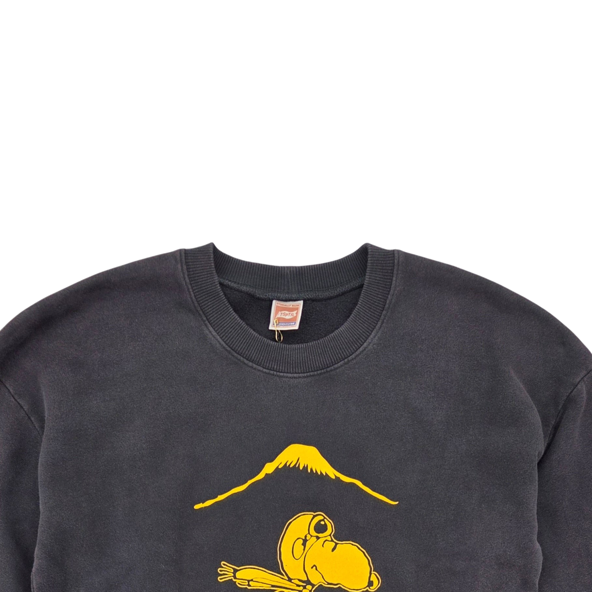MILWORKS Suka Snoopy sweatshirt in vintage black with a yellow graphic of Snoopy and Mount Fuji on the chest.