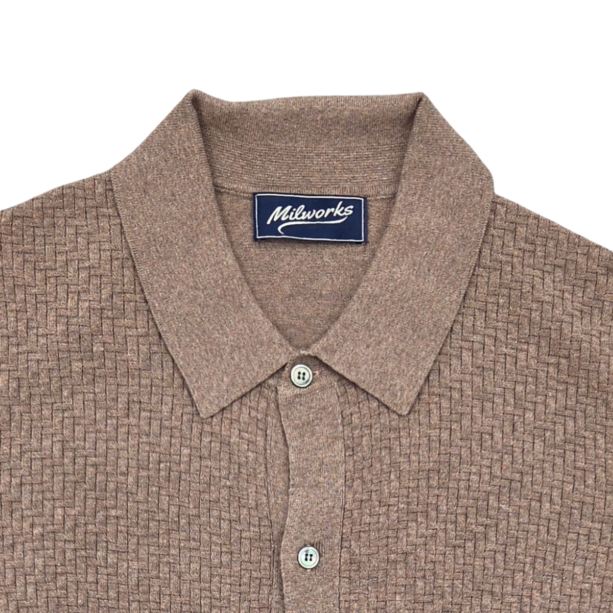 MILWORKS taupe short sleeve knit shirt with a basketweave texture, collared neckline, and button closure. Made from cotton and cashmere blend.