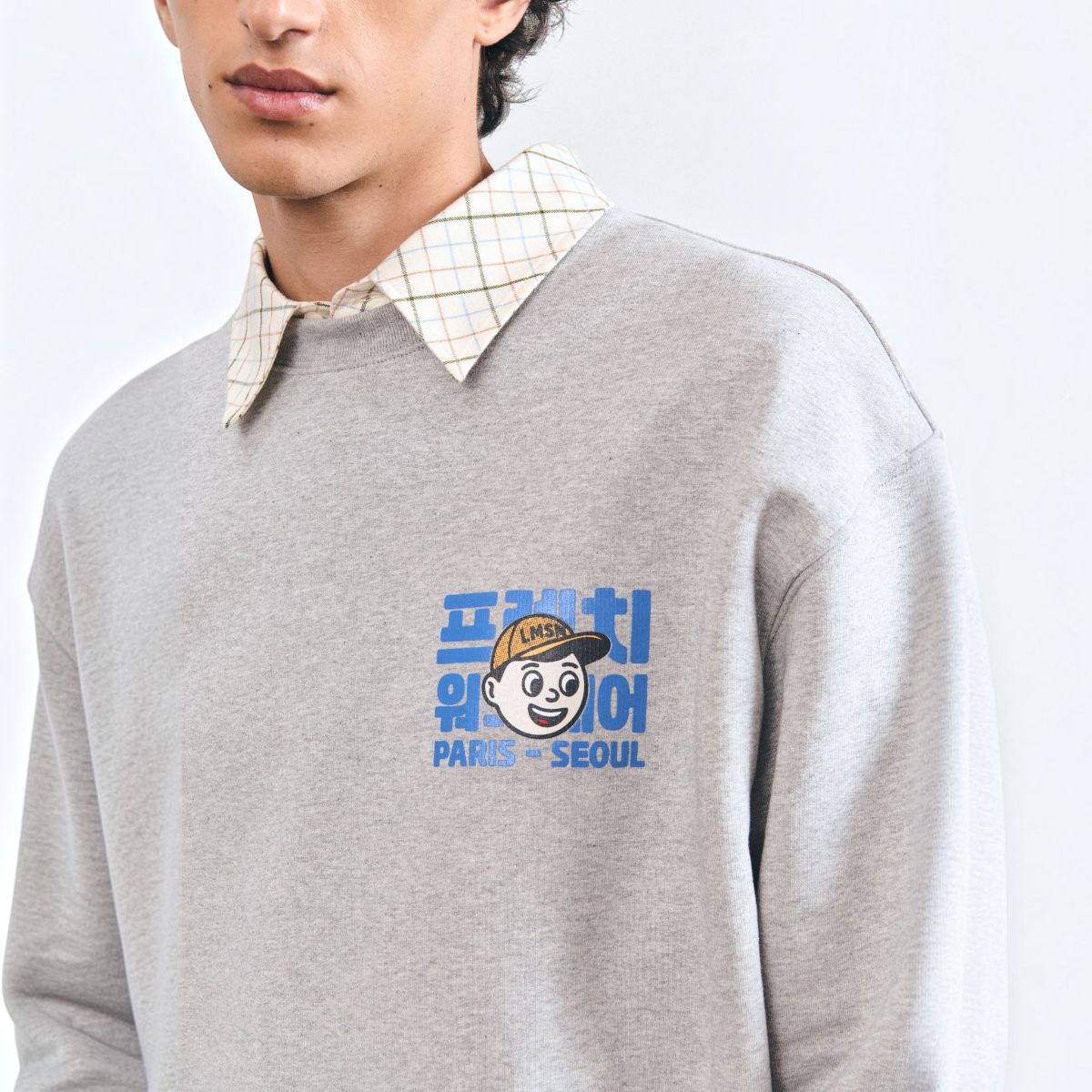 MILWORKS Thamar grey heavyweight cotton fleece sweatshirt with a vintage-inspired graphic print on the chest.