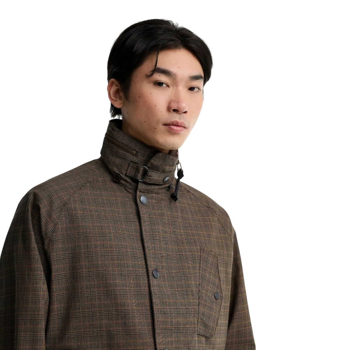 MILWORKS Transport Ursula waterproof jacket in dark stone check with a high stand collar on a male model