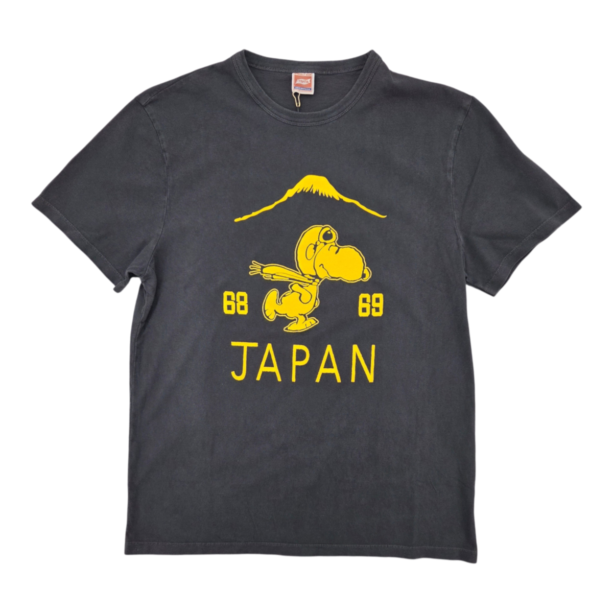 MILWORKS TSPTR Suka Snoopy t-shirt in vintage black with yellow graphic print of Snoopy, Mount Fuji, and Japan text.