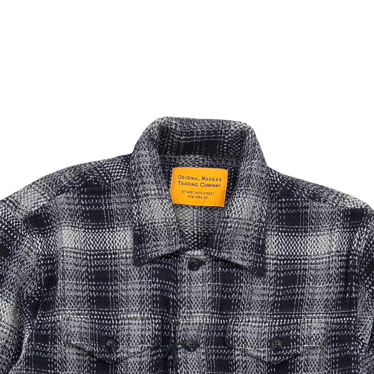 MILWORKS No176 utility jacket in a black and white handwoven cotton chevron weave check pattern with button details.