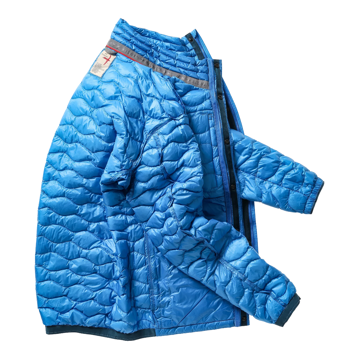 Milworks bright cobalt wave-quilt down jacket in lightweight nylon micro-ripstop with snap and zipper closure.